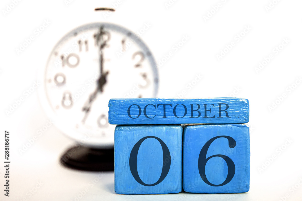 october 6th. Day 6 of month, handmade wood calendar and alarm clock on ...