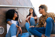 © Santi Nunez/Stocksy - Group of happy friends having fun in the street