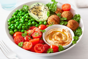 Wall Mural - healthy vegan lunch bowl with falafel hummus tomato avocado peas