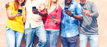 Teenagers Texting Mobile Phone Messages Row On Pink Background - Multiracial Friends Holding Smartphone Outdoors - Modern Communication Concept - Image