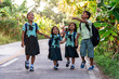 © Santi Nunez/Stocksy - Excited kids walking after school