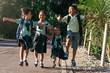 © Santi Nunez/Stocksy - Excited kids walking after school