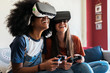 © Santi Nunez/Stocksy - Female friends playing video games at home