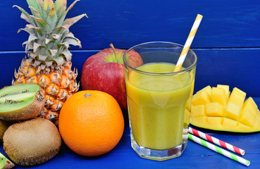 Poster - Fruit juice in a glass on wooden table