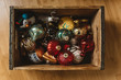 © Chelsea Victoria/Stocksy - Vintage christmas ornaments in a rustic wood box