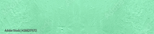 Panorama light green concrete background