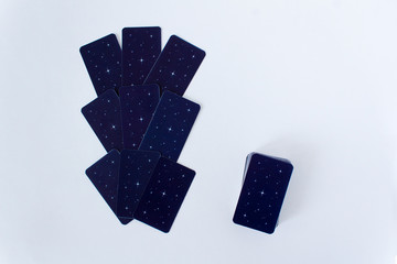 lines of tarot cards spread on white background