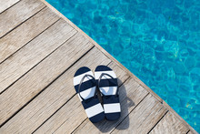 Flip Flops  At The Side Of Swimming Pool, Summer Travel Concept.
