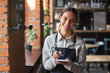 © fizkes - Head shot portrait of smiling waitress ready to take customer order