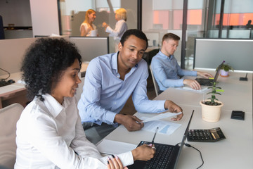 Poster - Black male supervisor analyze female trainee work at workplace