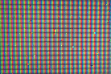 Water drops on pixilated surface. Display pixels grid texture. Monitor pixel macro background.