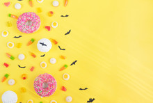 Halloween Candy.Halloween Holidays On Yellow Background, Colorful Decoration Toys, Baby Sweets, Donuts, Marmalade. Trick Or Treat, Terrible Night.Halloween Background.copy Space