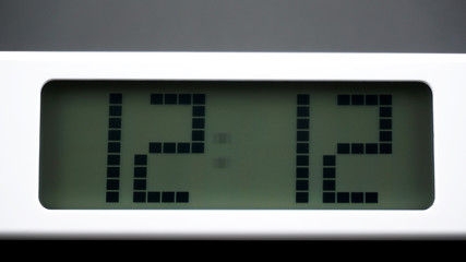 Digital alarm White clock time 12.12 am or pm on Black background, Time concept..