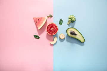 Different fruits and vegetables on a colored background.