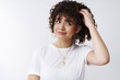 © Cookie Studio - Well maybe. Unsure cute flirty young hesitant attractive curly girl scratch head look aside smiling thinking make decision uncertain standing confused unsure what order make, white background