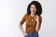 © Cookie Studio - That was excellent. Happy funny carefree curly hair european girl laughing joyfully approve awesome joke show okay ok agree gesture close eyes giggle have fun standing amused white background