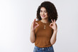 © Cookie Studio - Great deal trust me. Good-looking satisfied confident european female customer curly dark hair satisfied awesome haircut show okay ok perfect gesture smiling approval recommend excellent service