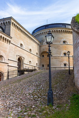 Canvas Print - Courtyard in Karlsborg's fortress in Sweden with a fortified wall