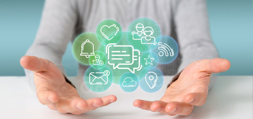 businessman holding a cloud of social media network icon