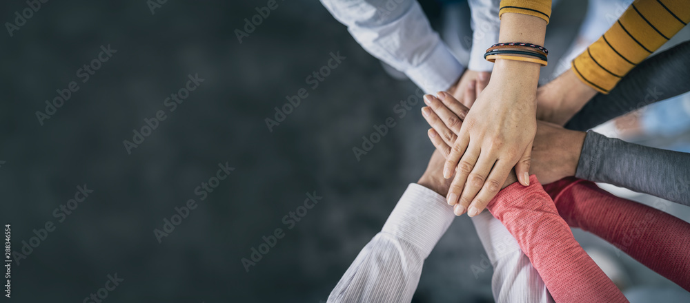 Stack of hands. Unity and teamwork concept. - obrazy, fototapety, plakaty 