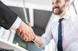 © REDPIXEL - Business people shaking hands, finishing up meeting.