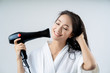 © torwaiphoto - Asian woman drying your hair after showering