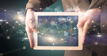 Poster - Elegant hand holding tablet with virtual database and network concept