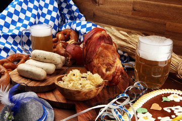 Traditional German cuisine, Schweinshaxe roasted ham hock. Beer, pretzels and various Bavarian specialties. Oktoberfest background