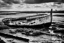 Decaying Wooden Boat In Estuary Marshland