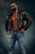 Macho Men in Leather Jacket on Naked Torso Exposing His Muscular Body