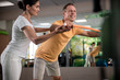 © Yakobchuk Olena - Male adult patient is doing forward bends