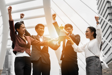 business background of asian business people being cheerful for being winner in business competition