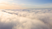 Aerial View White Clouds In Blue Sky. Top View. View From Drone. Aerial Bird's Eye View. Aerial Top View Cloudscape. Texture Of Clouds. View From Above. Sunrise Or Sunset Over Clouds