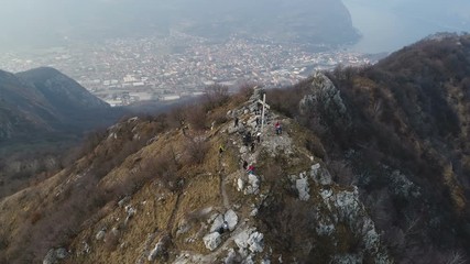 Wall Mural - Alpine peak with lake at the bottom of the valley - aerial view