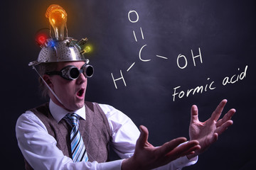 Nerd presenting handdrawn chemical formula of formic acid