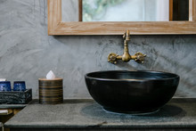 Black Sink, Vintage Copper Faucet, Gray Wall, Mirror, Loft Bathroom Interior Details. Close Up, Minimalism Concept