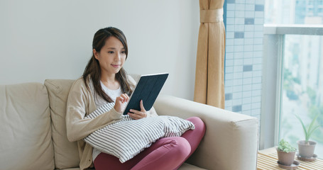 Wall Mural - Woman use of tablet computer at home