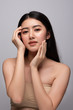 © Shutter B - Portrait of beautiful young asian woman clean fresh bare skin concept. Asian girl beauty face skincare and health wellness, Facial treatment, Perfect skin, Natural make up. Isolated on gray background