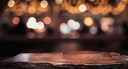 Wall Mural - Wood texture table top (counter bar) with blur light gold bokeh in cafe,restaurant background