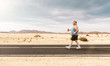 Funny overweight man jogging on the road with copy space
