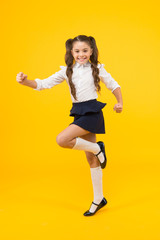 Wall Mural - Keep going. Active kid. Girl on way knowledge. Knowledge day. Back to school. Kid cheerful schoolgirl running. Pupil want study. Active child in motion. Freedom concept. Knowledge determined success