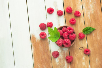 Wall Mural - Fresh and natural raspberry with mint on a wooden table