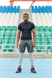 © alfa27 - serious confident strong musscular man in sportswear posing to the camera, full length photo. people, lifestyle, health and body care