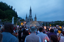 Lourdes, France, 24 June 2019: Evening Procession With Candles At The Shrine Of Lourdes