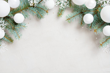 Wall Mural - White Christmas background with Christmas tree branches, snowflakes and balls