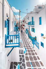 Naklejka na meble Typical Greek architecture in the white, cobbled alleys of Mykonos town, houses in the old town of Chora with colorful balconies and white churches, Cyclades, Greece