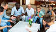 © JackF - Portrait of big multigenerational family  chatting on sofa