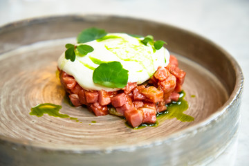 Wall Mural - Beef tartare with sour cream is on the plate