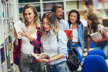 Poster - Group of college students at the library smiling