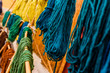 Yarns of colored wool freshly dyed by Arab craftsmen drying in the sun.